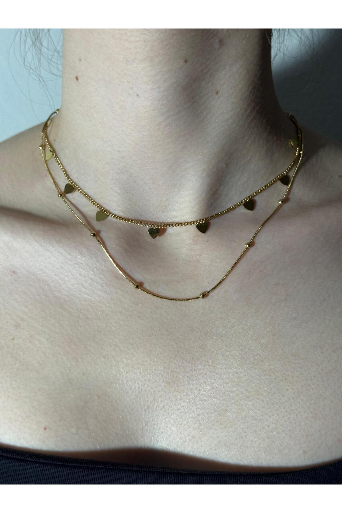 Kalp ve Minik Top Detaylı Gold Kaplama Çelik Kolye